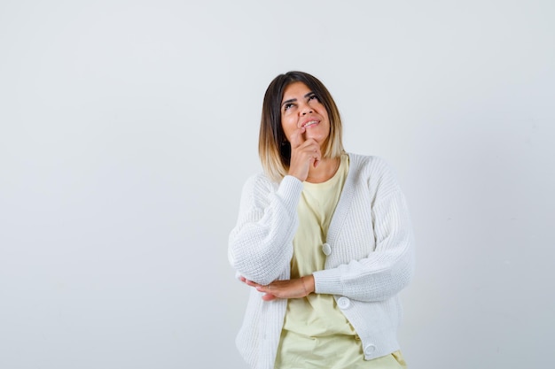 Young woman wearing a white cardigan