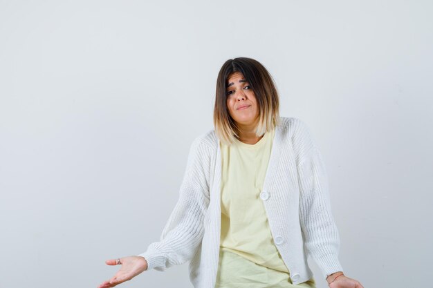 Young woman wearing a white cardigan