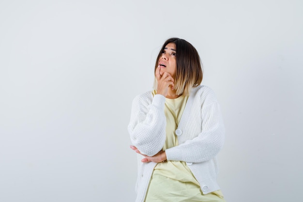 Young woman wearing a white cardigan