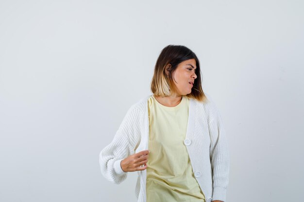 Young woman wearing a white cardigan