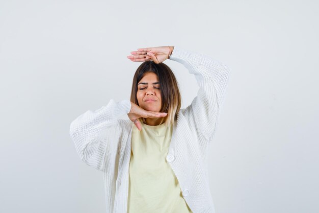 Young woman wearing a white cardigan