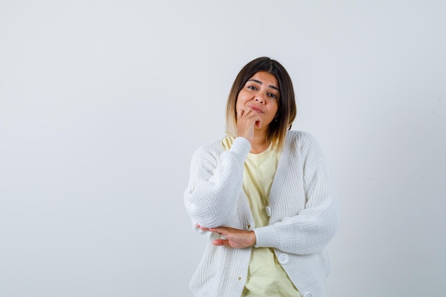 Young woman wearing a white cardigan