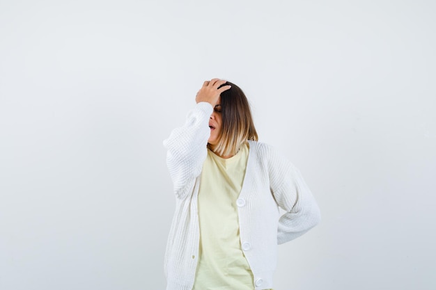 Young woman wearing a white cardigan