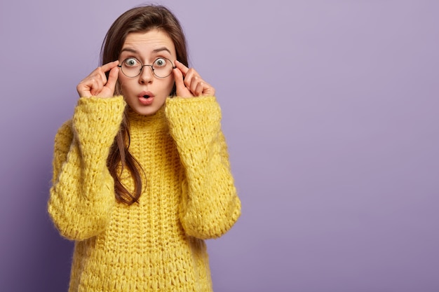 Young woman wearing yellow sweater