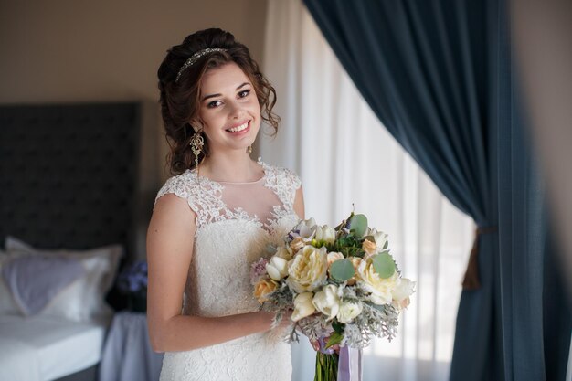 young woman in wedding dress indoor