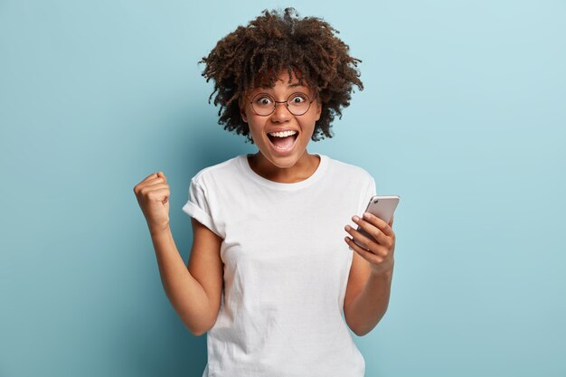 Young woman with Afro haircut wearing white T-shirt