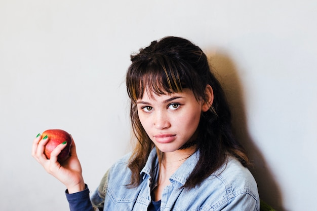 Young woman with apple