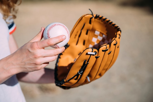 Free photo young woman with baseball and glove