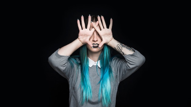 Young woman with black lipstick posing