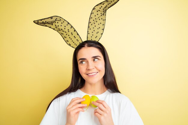 Free Photo young woman with bunny ears for easter