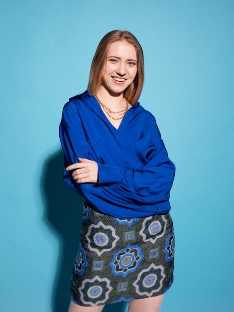 Young woman with chain necklace posing