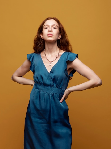 Young woman with chain necklace posing