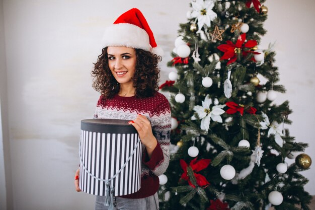 Young woman with christmas gifts