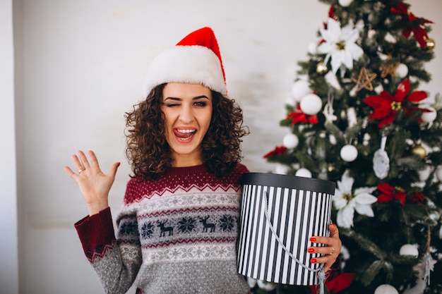 Young woman with christmas gifts