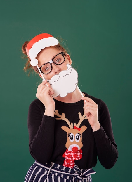 Free photo young woman with christmas masks