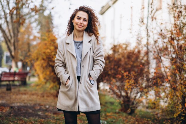 Free Photo young woman with curly hair in park