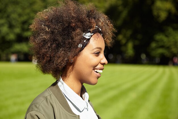 Young woman with curly hair wearing bandana