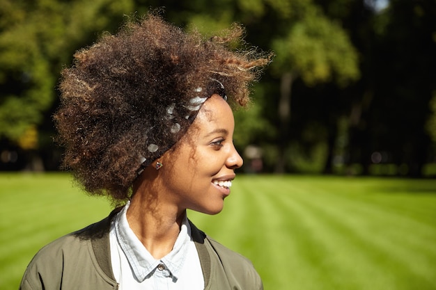 Young woman with curly hair wearing bandana