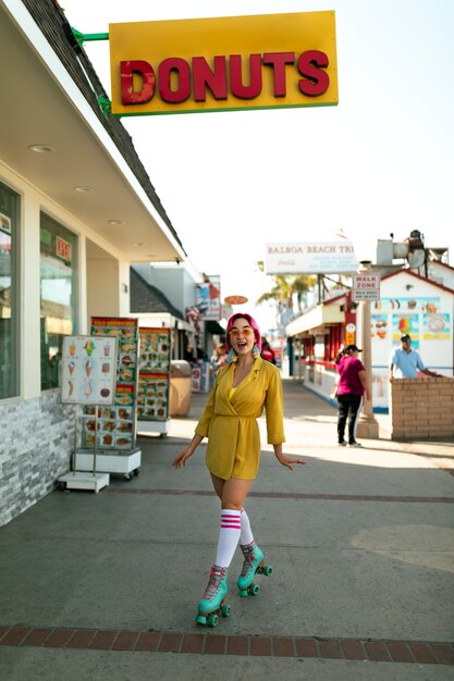 Young woman with dyed hair near shop