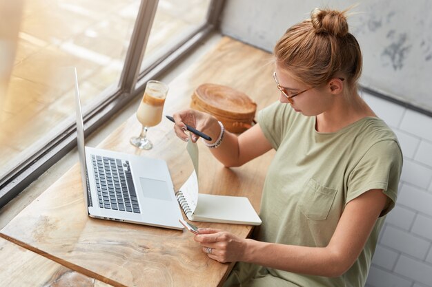 Young woman with glasses in cafe