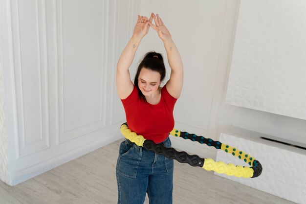 Young woman with hula hoop