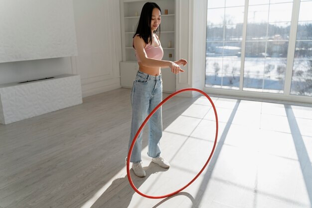 Young woman with hula hoop