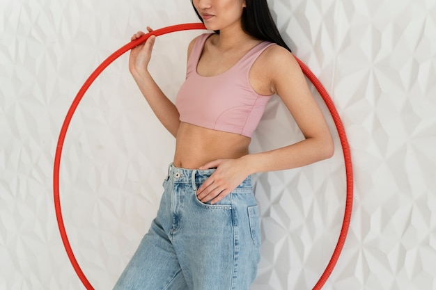 Young woman with hula hoop