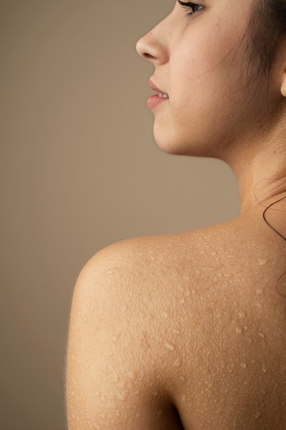 Young woman with hydrated skin back view