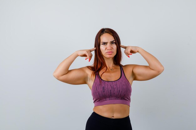 Young woman with long hair wearing sportswear