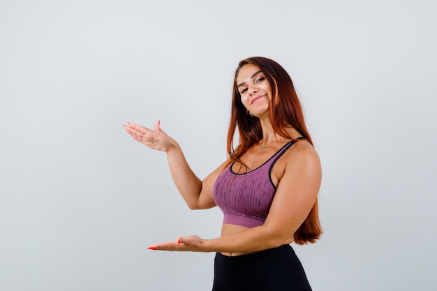 Young woman with long hair wearing sportswear