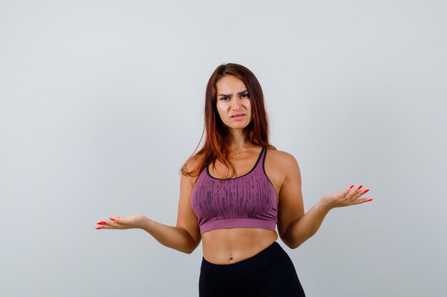 Young woman with long hair wearing sportswear