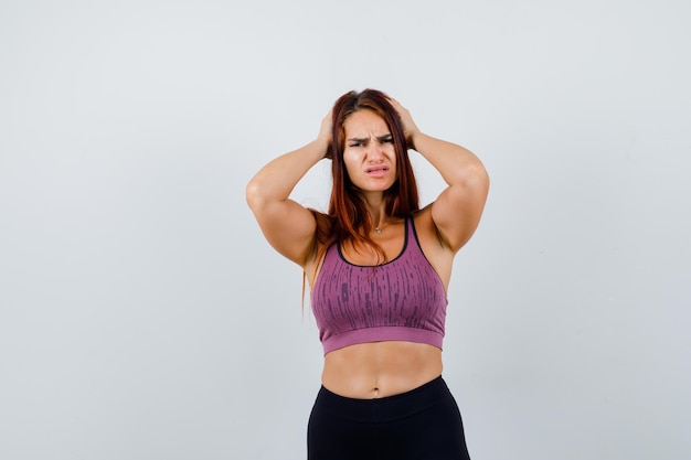 Young woman with long hair wearing sportswear