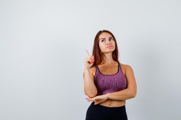 Young woman with long hair wearing sportswear