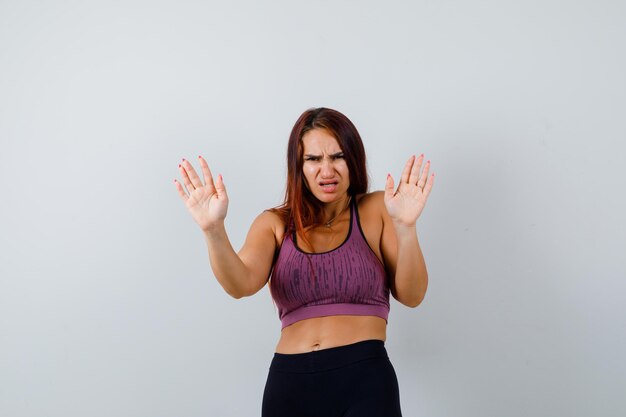 Young woman with long hair wearing sportswear