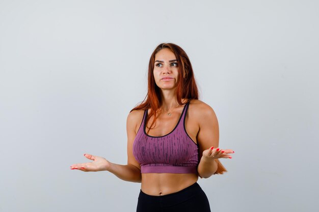 Young woman with long hair wearing sportswear