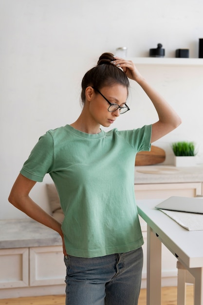 Free photo young woman with messy bun