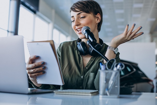 Free Photo young woman with microphone recording voice acting