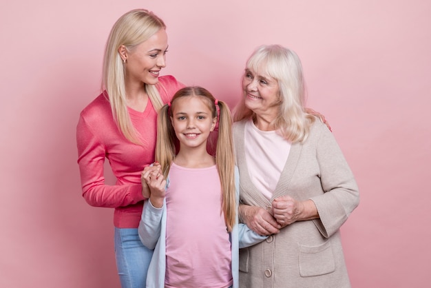 Free photo young woman with mother and grandmother