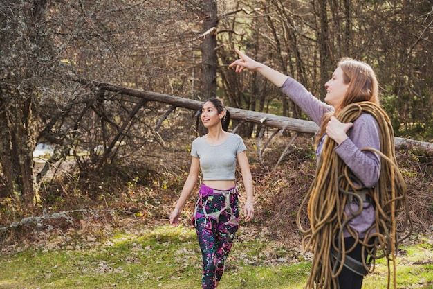 Young woman with ropes pointing at something