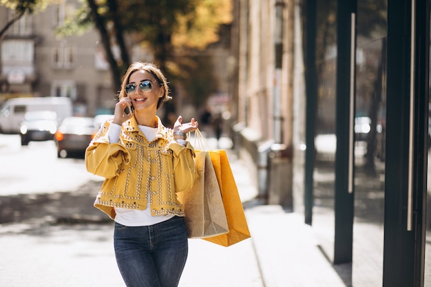 Young woman with shopping bags in the city