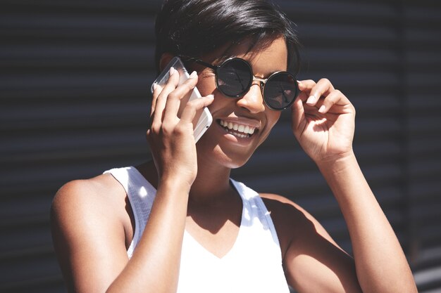 Young woman with short hair talking on the phone