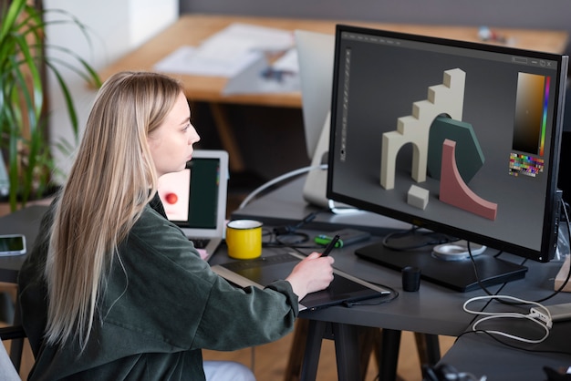 Free photo young woman working in an animation studio