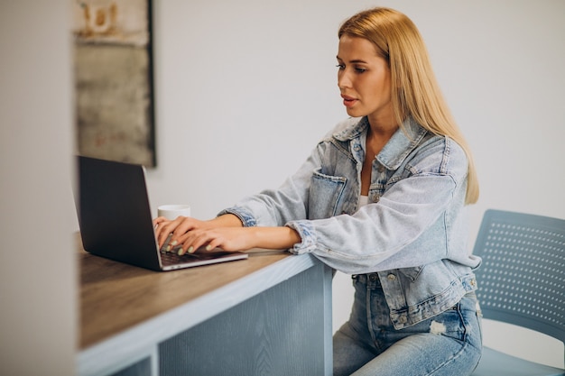 Young woman working on computer from home