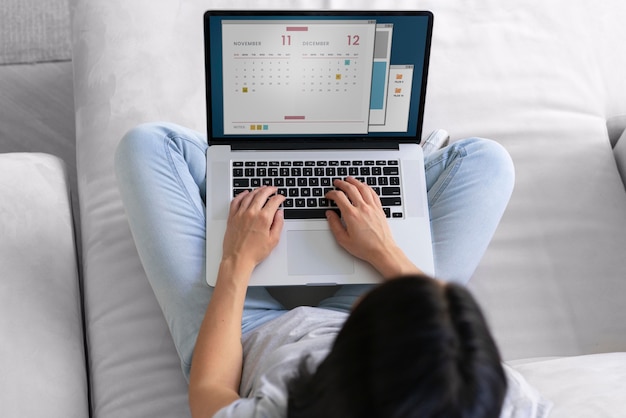 Young woman working on her laptop at home