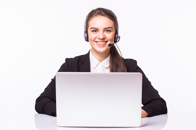 Free Photo young woman working in office with laptop and headphones on white wall, customer service and call center.