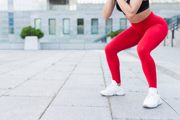 Young woman working out at the street