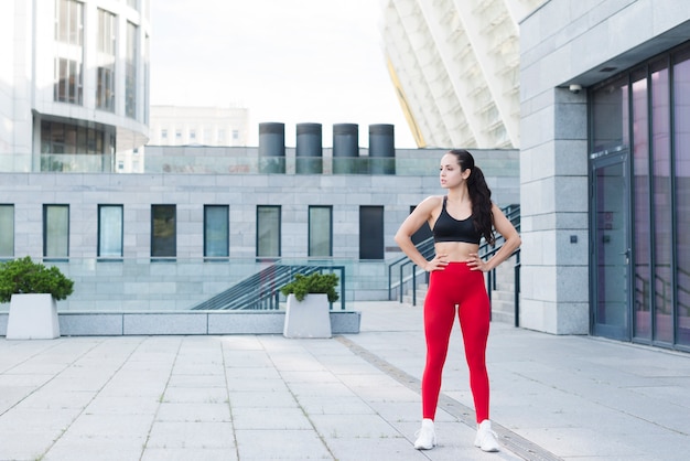 Young woman working out at the street