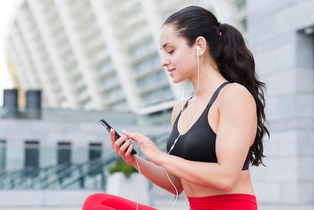 Young woman working out at the street