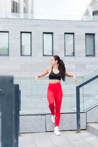 Young woman working out at the street