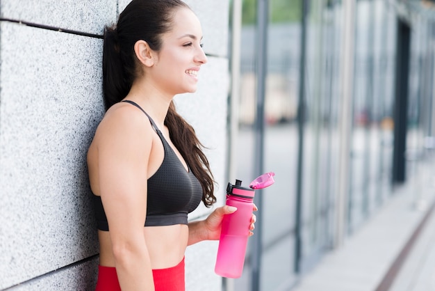 Free photo young woman working out at the street